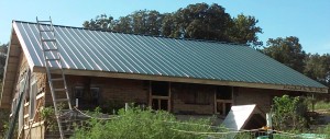 This picture shows the new metal roof that was installed. We ended up completely rebuilding the roof with new rafters since the old ones were undersized and in bad shape.